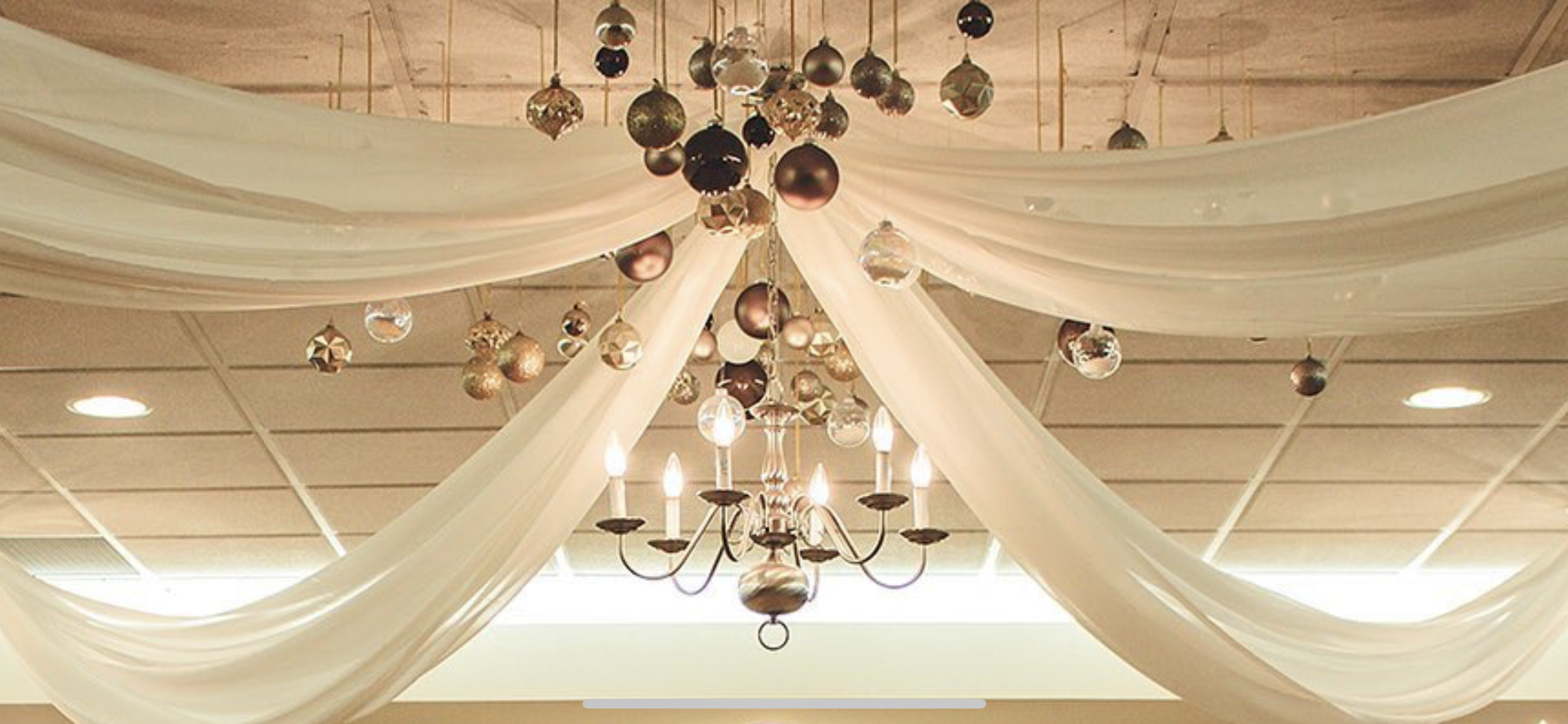 Gorgeous chandalier and hanging decor for a wedding reception.